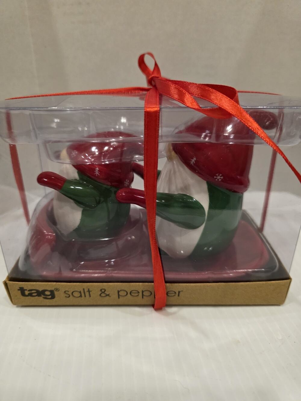 Tag sledding Christmas Gnomes salt and pepper set new in box. ~ 4" and 3" T